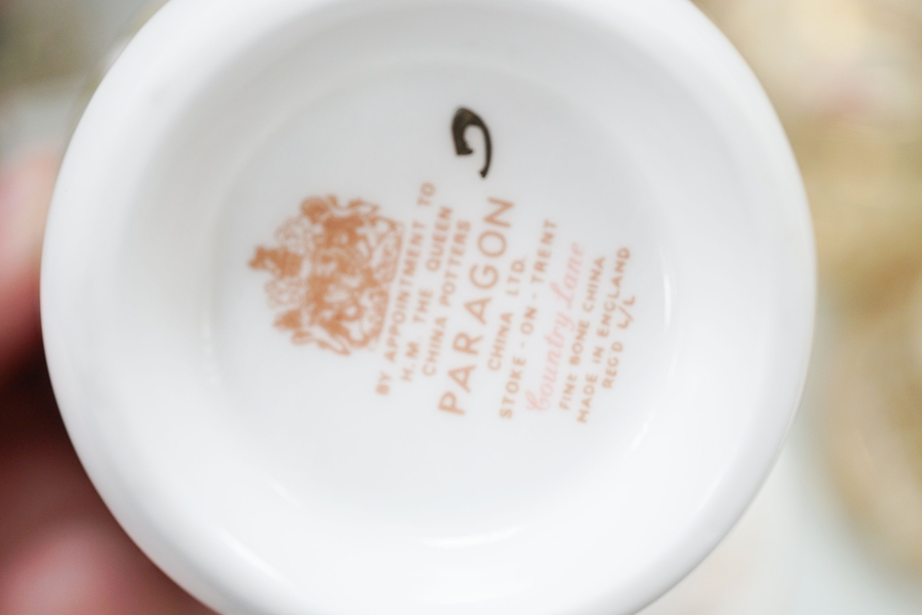 A Crown Staffordshire fifty nine piece part tea set and dessert service, central flowers and gilt borders